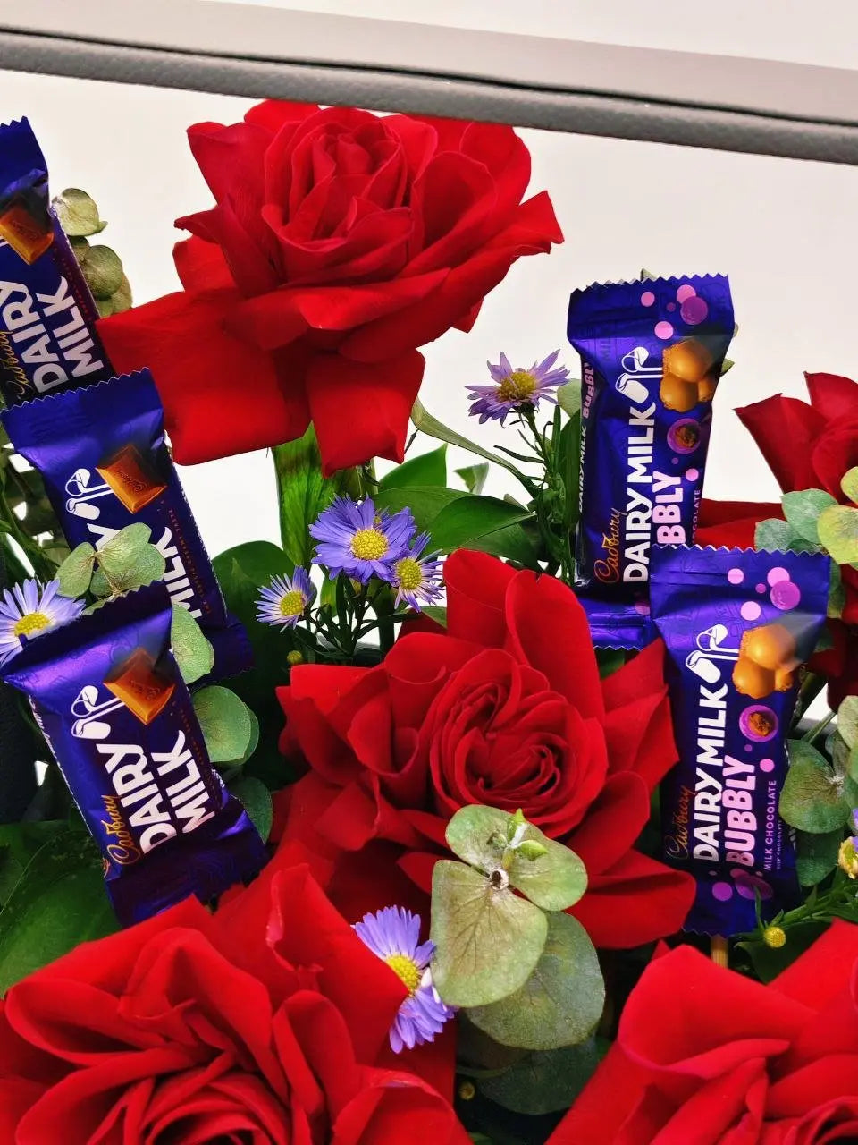 Sweet Scarlet Tray – Red Roses, Cadbury Chocolates & Aster in Handle Tray (UAE Delivery) - OnlineGifts