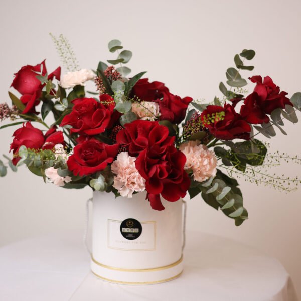 Sweet Wild Bloom Flower Bouquet – Red Roses, Pink Carnations & Skimmia in White Box (Delivery in UAE)
