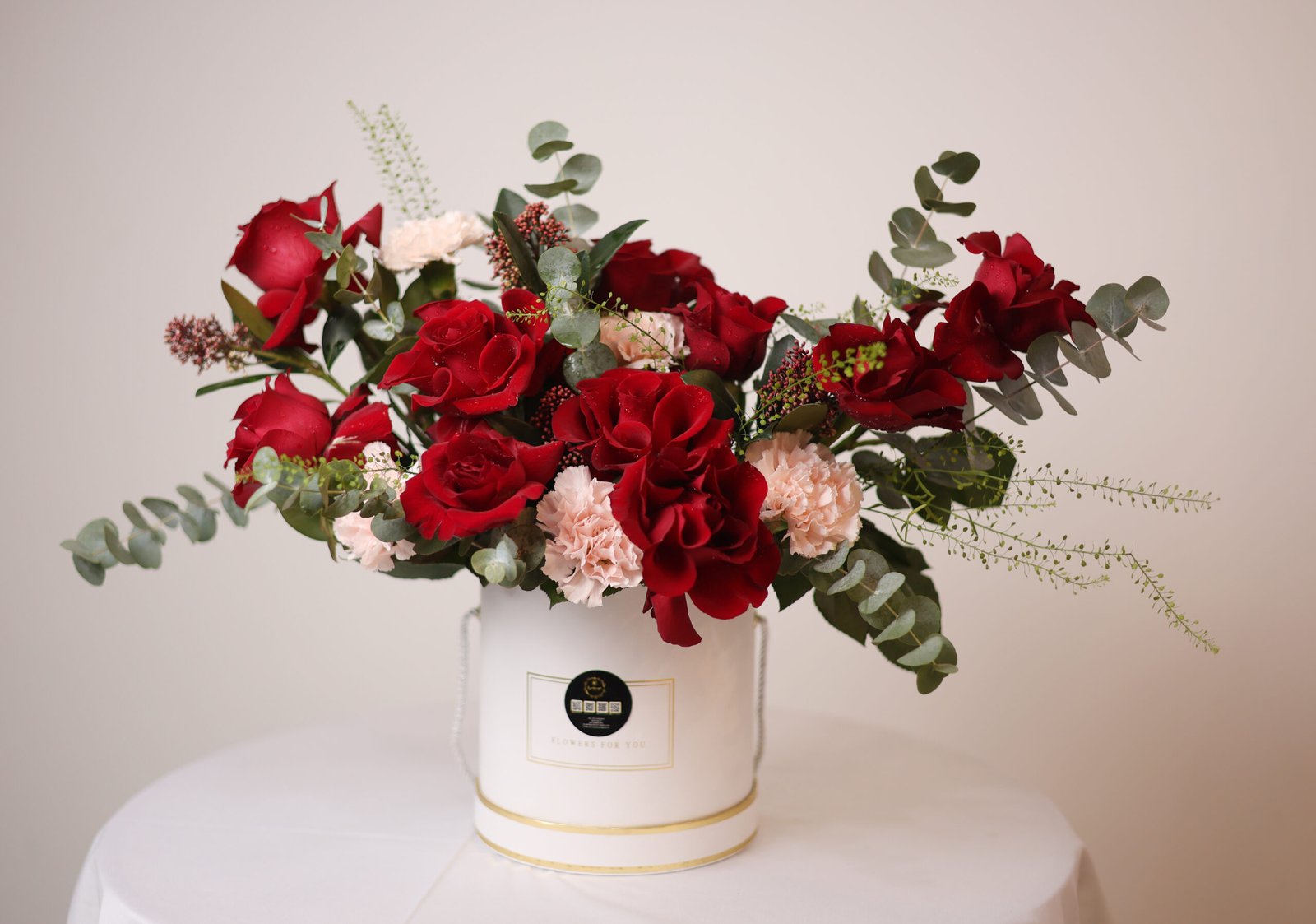 Sweet Wild Bloom Flower Bouquet – Red Roses, Pink Carnations & Skimmia in White Box (Delivery in UAE)