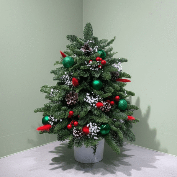 Mini Christmas Tree Centerpiece with deep green evergreen foliage, red and green ornaments, miniature gold gift boxes, and pineconesHighly descriptive for Image SEO.