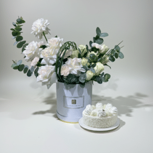 Elegant Ohara Roses, white roses, and light pink carnations in a white box with 500g Raffaello White Cake combo for luxury gift delivery
